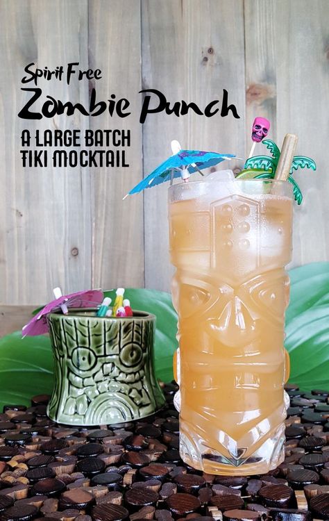 This spirit free Zombie Punch is a tasty non-alcoholic take on the tropical sweet and bitter flavors of a classic tiki cocktail. #tropical #mocktail #punch #party | FeastInThyme.com via @feastinthyme Non Alcoholic Tiki Drinks, Tiki Mocktail Recipe, Tiki Dinner Party, Spooky Tiki Party, Halloween Tiki Party, Tiki Shots, Tropical Mocktails Non Alcoholic, Tiki Punch Recipe, Zombie Punch