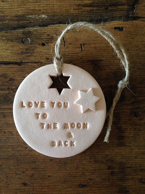 A lovely decoration made from air drying clay. Great nursery decoration, makes a lovely new baby gift, baby shower gift or a thoughtful present for Valentines or Mothers Day. The decoration is hand-stamped and hung with natural twine. It measures 7cm (2 3/4 inches) across. The colour is a blush (peach/pink). It will be beautifully gift wrapped in a box as shown (box colour may vary). Why not create your own unique gift by personalising a clay decoration with the message of your choice: h... Mothers Day Polymer Clay Gift Ideas, Mother’s Day Clay Ideas, Mothers Day Ceramic Ideas, Clay Mothers Day Gifts, Clay Tags, Salt Dough Crafts, Clay Gift Tags, Clay Christmas Decorations, Dough Ornaments