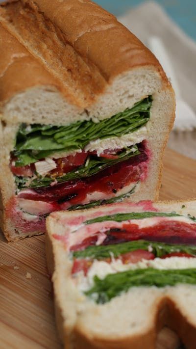 Tastemade: Layered Picnic Loaf ~ Recipe Cooked Peppers, Muffaletta Recipe, Cooked Beetroot, Large Farmhouse, Veggie Sandwich, Simple Sandwiches, Cooked Chicken, Picnic Foods, Wrap Recipes