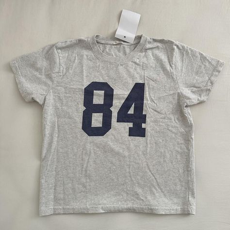 brandy melville 84 top

- NEW WITH TAGS
- not sold... - Depop Brandy Melville Mayson Top, Brandy Melville Number Tee, Brandy Melville Wishlist, Cute Graphic Tees Aesthetic, Clothes Brandy Melville, Brandy Clothes, Brandy Melville Clothes, Brandy Shirt, Brandy Top