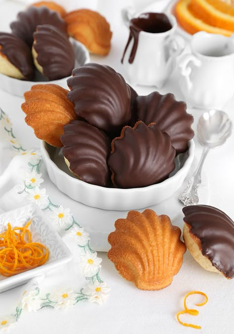 Chocolate Dipped Orange Madeleines Glazed Madeline Cookies, Chocolate Covered Madeline Cookies, Madeline Cookies Decorated, Madeleine Flavors, Chocolate Dipped Madelines, Christmas Madeleines, Pumpkin Madeleines, Madeleine Cookies Recipe, Orange Madeleines