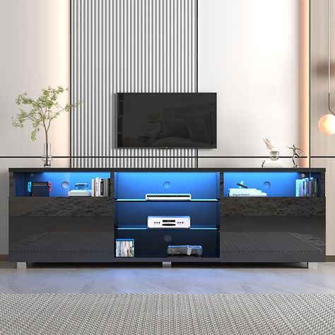 New 🎉 St.Mandyu LED TV Stand for 50/55/60 inch TV, Modern Television Table Center Media Console with Drawer and Led Lights, High Glossy Entertainment Center for Living Game Room Bedroom, Black¡ 【High Quality LED TV Stand】High-hardness durable particleboard + tempered glass, using a smooth paint process, while ensuring firmness and permeability, it is very beautiful and practical. 【 Adjustable LED Remote System】Equipped with remote control, features 20 colors of RGB LED lights and 8 flash effe... Television Table, 80 Inch Tv, Gaming Entertainment Center, Game Room Bedroom, Led Tv Stand, Audio Room, Bedroom Black, Rgb Led Lights, Table Centers