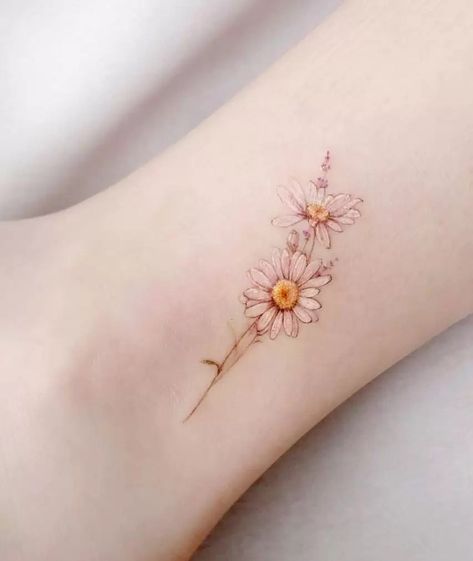 The Ultimate Guide To Flower Tattoos Flower Scar Tattoo, Delicate Daisy Tattoo Simple, Small Watercolor Flower Tattoo, Small Daisy Flower Tattoos, Daisy Tattoo Designs Vintage, Delicate Daisy Tattoo, Daisy Fine Line Tattoo, Tiny Daisy Tattoo, Dainty Daisy Tattoo