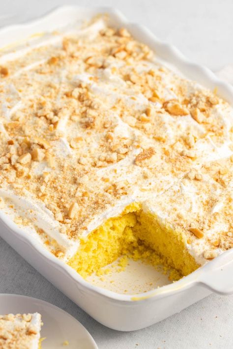 This banana pudding poke cake is a delicious twist on the classic Southern dessert. It's just as sweet and creamy but way easier to make. Yellow Poke Cake Recipes, Yellow Poke Cake, Banana Poke Cake, Cake Easy Recipe, Banana Desserts, Yellow Cake Mix Recipes, Banana Pudding Poke Cake, Pudding Poke Cake, Caramel Apple Dump Cake