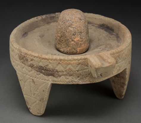 JUDAEA. Hellenistic - Roman era, circa 300 BCE -100 CE. Stone mortar and pestle. Shaped from gray sandstone, the spouted bowl (mortar) is 6.75 inches (17 cm) in diameter and stands 3.5 inches (9 cm) tall on its three feet; the ovoid pestle is of similar stone and is 3 inches long. The exterior of the mortar and three ovoid feet are decorated with geometric motifs. Tree House Bedroom, Cooking Hearth, Stone Mortar, Diy Utensils, Mortar Pestle, Vintage Kitchen Utensils, Roman Era, Ancient Greek Art, Ancient Technology