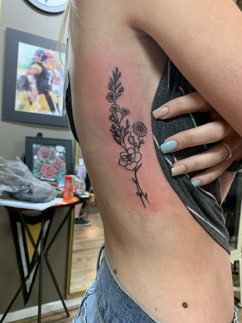 Rib cage flower tattoo. Larkspur and Daisy’s Birth Flower Side Tattoos, Larkspur Daisy Tattoo, Side Tattoos Women Flower, Daisy Larkspur Tattoo, Tattoo Ideas On Rib Cage, Rib Cage Tattoo Women, Tattoo For Side Rib Cage Women, Side Rib Cage Tattoo, Flower Tattoos Rib Cage