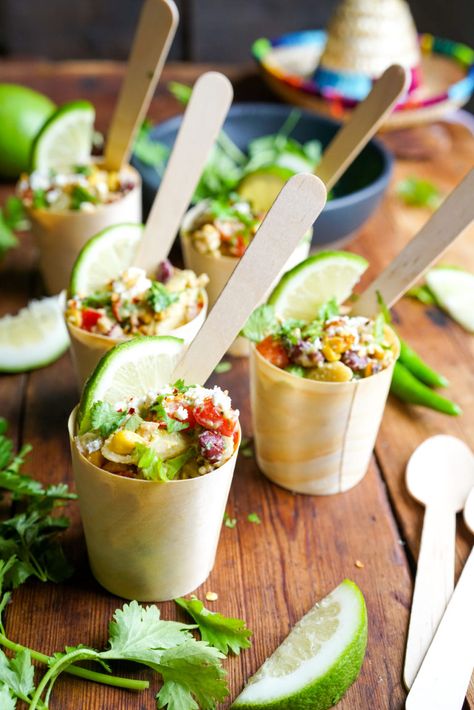 A delicious Mexican Street Corn Pasta Salad in bamboo cups makes for a perfect party food - neat, delectable and in bio-degradeable packaging! Grab the ultimate Mexican Street Corn Pasta Salad recipe right here! #partyfood #partysalad Small Salads Cups, Pasta Salad In A Cup, Mexican Charcuterie Cups, Mini Pasta Cups, Boating Appetizers, Individual Salads For Parties, Party Food In Cups, Individual Appetizers In A Cup, Mexican Charcuterie