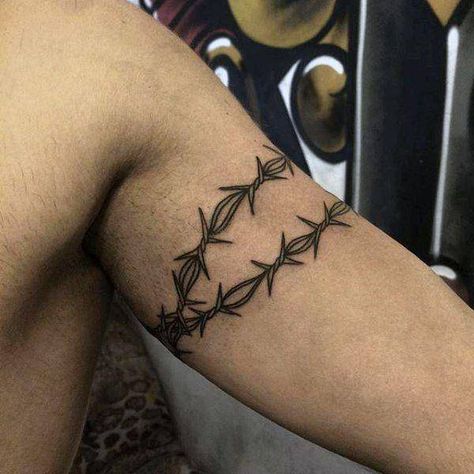 Prison tattoos and what they mean Arm Wrap Tattoo, Barbed Wire Tattoo, Tattoo Bras Homme, Wire Tattoo, Barbed Wire Tattoos, Around Arm Tattoo, Wrap Around Tattoo, Tato Dengan Makna, Wrap Tattoo