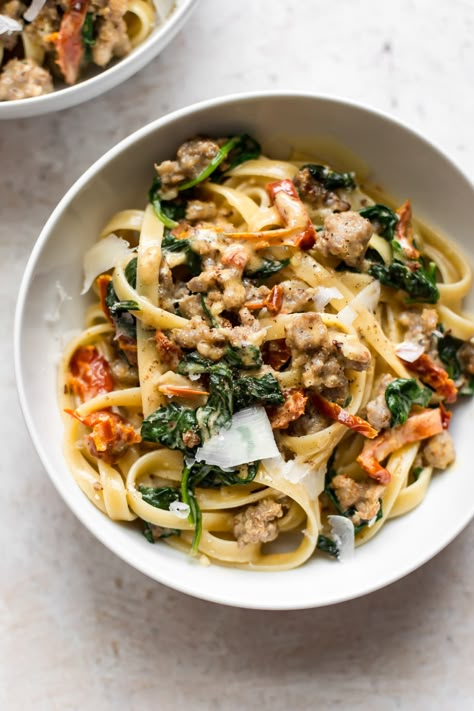 This creamy spinach sausage pasta in a Tuscan cream sauce of spinach, basil, sun-dried tomatoes, garlic, cream, Dijon mustard, and lemon juice is sure to become a family favorite. It's quick and easy. Creamy Tuscan Sausage Pasta, Tuscan Sausage Pasta, Tuscan Sausage, Creamy Sausage Pasta, Sausage Spinach Pasta, Sausage Pasta Recipe, Night Dinner Recipes, Sausage Pasta Recipes, Italian Sausage Recipes