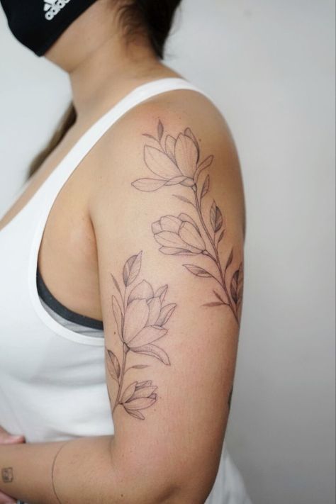 Wrap Flower Tattoo Arm, Mix Style Tattoo, Minimalist Floral Sleeve Tattoo, Floral Sleeve Tattoo Minimalist, Simple Floral Shoulder Tattoo, Shoulder Arm Wrap Tattoo, Flower Wrap Around Tattoo Shoulder, Magnolia Tattoo Upper Arm, Simple Floral Half Sleeve Tattoo