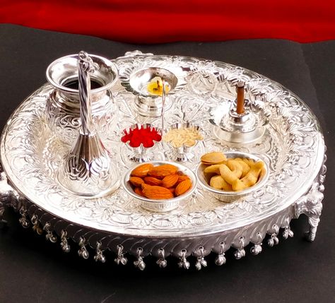 Description 1- elephant leg thali 11" 1- kalasha 1- handle Diya 1- agarbatti stand/incense holder 1- bell 1- Kumkum stand attached 2- Prasad bowl Silver Pooja Thali, Silver Lamps, Agarbatti Stand, Aarti Thali, Green Suit Men, Silver Home Accessories, Mere Mahadev, Pooja Thali, Pooja Items