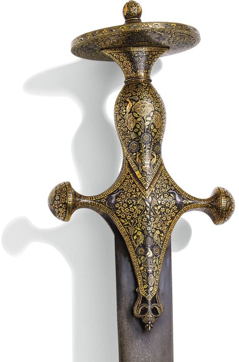 A FINE MUGHAL GOLD-INLAID SWORD (TALWAR) BEARING THE NAME OF NAWAB DHU’-FAQAR AL-DAWLAH BAHADUR, INDIA, SECOND HALF 18TH CENTURY | Arts of the Islamic World | | Sotheby's Mughal Empire Swords, Mughal Miniature, Mughal Miniature Paintings, Empire Tattoo, Historical Swords, Types Of Swords, Arab Culture, Miniature Paintings, Cool Swords