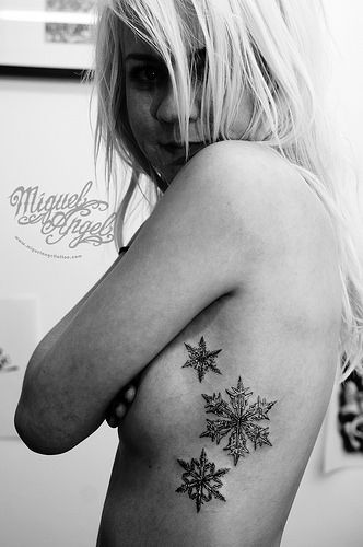 Snowflakes tattoo Girl Rib Tattoos, Snowflake Tattoo, Rib Tattoos For Guys, Tattoos On Side Ribs, Snow Flake Tattoo, Wild Tattoo, Tattoo Zeichnungen, Tattoo Designs For Girls