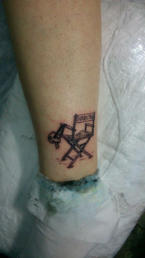 director chair tattoo simple tattoo minimal tattoo Cinematic Tattoo Ideas, Director Chair Tattoo, Tattoo Ideas Theatre, Chair Tattoo Design, Director Tattoo, Movies Tattoo Ideas, Theatre Tattoo Ideas, Cinema Tattoo Ideas, Film Tattoo Ideas Movies