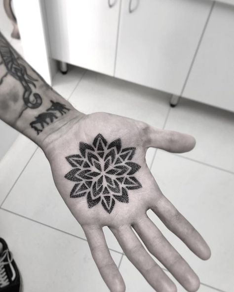 a list with 50 of the most beautiful mandala tattoo designs we've seen and the symbolism behind this sacred & timeless pattern. #mentattoo #wristtattoo Mandala Palm Tattoo, Palm Tattoo Hand, Palm Tattoo Ideas, Best Wrist Tattoos, Hand Palm Tattoos, Yogi Tattoo, Mandala Tattoo Designs, Palm Tattoo, Toe Tattoos