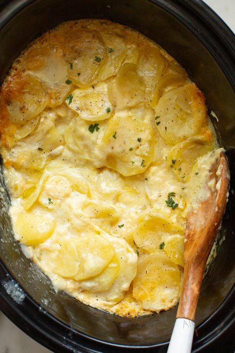 Easy, creamy scalloped potatoes from scratch with simple ingredients. Cook this potato casserole slowly in the crock pot until, creamy, tender, golden, and bubbly. Potato perfection! #alyonascooking easyrecipe #scallopedpotatoes #potatorecipe #creamypotatoes #sidedish #easysidedish #festiveside #Thanksgiving #noroux #casserole #crockpot Crock Pot Scalloped Potatoes, Crockpot Scalloped Potatoes, Potato Recipes Crockpot, Easy Cheesy Scalloped Potatoes, Scalloped Potatoes Crockpot, Slow Cooker Scalloped Potatoes, Creamy Scalloped Potatoes, Scalloped Potato, Scalloped Potatoes Easy