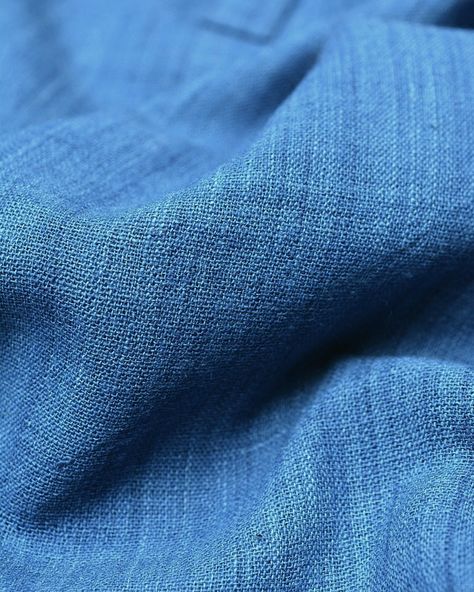 Get close and personal with our indigo-dyed ambara charaka handspun and handwoven cotton fabric. This fabric, rich in texture and hue, is just a glimpse of the beauty that awaits in our upcoming collection. We're presenting Indigo Essentials on Tuesday, August 6th, at 7:30 am. #Indigoessentials #Comingsoon #Metaphorracha Indigo Dyed Fabric, Indigo Dye, The Beauty, Hand Weaving, Cotton Fabric, Dye, Texture, Fabric, Beauty