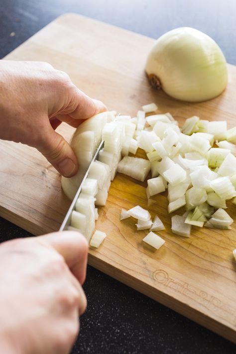 A properly cut onion starts with a sharp knife and the right technique. Our step by step guide explains how to mince, dice, or chop an onion for recipes. Butternut Squash Bisque, How To Cut Onions, Vegetable Scraps, Bawang Bombay, Veggie Stock, Cooks Illustrated, Vegan Soups, No Cooking, Diced Onions