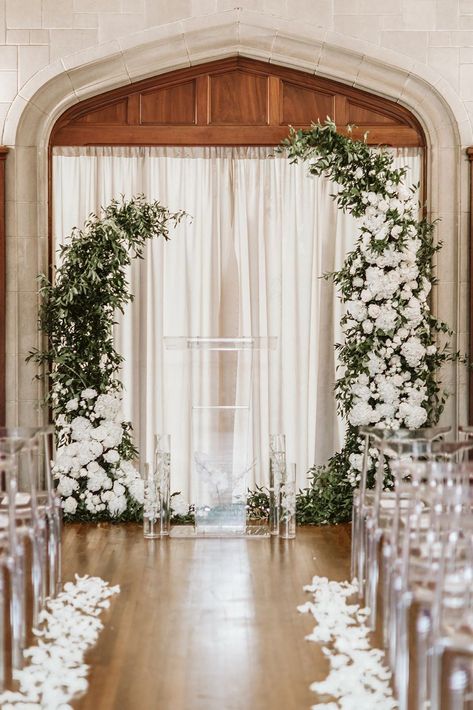 Instead of building a full runner of petals, opt to line your ceremony aisle with them to keep things slightly cleaner. Channel a modern wedding vibe by combining them with lucite chairs and a greenery arch for your fall wedding. Head to the link for more stunning flower petal wedding decor ideas. // Photo: Ashlyn Cathey Photography Wedding Alters, Indoor Wedding Ceremonies, White Wedding Theme, Wedding Decor Ideas, Wedding Design Decoration, Wedding Altars, Wedding Aisle Decorations, Indoor Ceremony, Wedding Petals