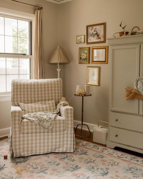 Enter @ourkinandhome’s inviting nursery nook, complete with the Crawford Glider in Tan Gingham. From the floral gallery wall to the antique-inspired furniture, it’s the perfect sweet and cozy corner. 🪟 Gingham Nursery, Nursery Seating, Cottage Nursery, Closet Art, A Peaceful Place, I Want Her, Baby Room Themes, Baby Room Inspiration, Peaceful Place