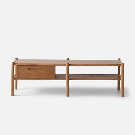 The perfect balance of function and form, this versatile bench offers storage and seating in one full sweep. An ideal option for small spaces, each piece features slim, rounded wood legs and a roomy lower shelf with removable wooden box for stowing away baskets, shoes, or everyday essentials. • Crafted from solid white oak and veneered MDF • Natural finish highlights the beauty of the rich wood grain • Sourced from North American hardwoods | Nora Storage Console / Bench in Oak by Schoolhouse White Oak Natural Finish, Green Tv Stand, 70s Houses, Console Bench, Oak Storage Bench, Low Shelf, Hallway To Bedrooms, Storage And Seating, Storage Console