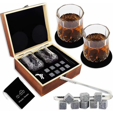 This handsomely-designed whiskey set turns any home bar into the focal point of the room. The burnt-wood gift box even stores these professional-grade bar tools stylishly. The whiskey stones gift sets includes 8 whiskey cooling stones, 2 glasses and coaster,a handmade wooden box, a black velvet pouch to carry whiskey rocks, a small tweezers convenient for taking a stone. #AGMSolutions #CustomPromo #PromoProducts #WhiskeySet #WhiskeyRocks #FathersDay Whiskey Gift Box, Whiskey Glass Set, Whisky Gift Set, Scotch Whiskey Glass, Whiskey Glasses Set, Whiskey Stones, Whiskey Set, Wood Gift Box, Handmade Wooden Boxes