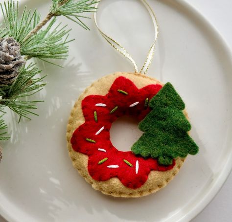 Christmas donuts are here! You can choose for your donut to be an ornament or plain as a bowl filler. Made and sewn by hand with high quality wool felt, these are not craft store felt. Available ✨made to order✨ online or in person at @bellevillemarket and @thehivelocal if you’re #lehighvalley local! Felt Ball Ornaments, Christmas Donuts, Felt Projects, Bowl Fillers, Craft Store, Felt Ball, Felt Diy, Felt Ornaments, Ball Ornaments