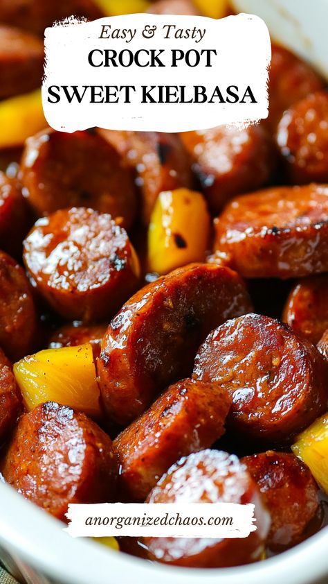 Sweet and savory Crock Pot Sweet Kielbasa is the ultimate crowd-pleasing appetizer or easy dinner! Made with tender kielbasa coated in a sticky, flavorful glaze, this slow cooker recipe is perfect for game days, holidays, or weeknight meals. With minimal prep and maximum flavor, this dish is a must-try for fans of quick and delicious comfort food. Pin now and save this irresistible recipe for your next gathering! Crockpot Recipes Keilbasa, Crockpot Kielbasa Appetizer, Recipes For Kielbasa Sausage, Quick Dinner For A Crowd, Crockpot Recipes With Kielbasa, Kielbasa Sausage Recipes Crockpot, Recipe With Kielbasa Sausage, Polska Kielbasa Recipes Easy Dinners, Crockpot Keilbasa Recipes Easy