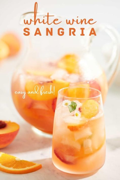 If you like a light and refreshing drink, then try this White Wine Sangria Peach recipe. This sangria has a surprising twist of a sparkling white wine that's flavored with peaches. And to elevate this cocktail add plenty of fresh peaches to the drink. Boston Pizza White Sangria Recipe, Sangria With Brandy Recipe, Spring Sangria Recipes White Wines, White Sangria Recipe For A Crowd Parties, White Cranberry Peach Cocktail, White Sangria Recipe Easy Summer, Prosecco Sangria Recipes, Peach Sangria Recipes Easy, White Sangria Recipe Peach