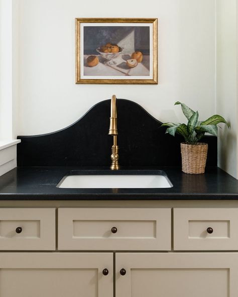 This laundry room + mudroom combo🤌🏻 Laundry design, mudroom design, #laundryinspo, laundry sink, Arkansas interior designer, interior design, mudroom cabinets, laundry sink, gold faucet, black countertops, honed granite, #laundryroom #mudroom, European inspired, transitional design, #organicmodern Laundry Room Soapstone Counters, Black Quartz Countertops Laundry Room, Laundry Room Mudroom Combo, Mud Room Sink, Black Utility Sink In Laundry Room, Soapstone Laundry Sink, Black Fireclay Farmhouse Sink, Laundry Room Countertop, Laundry Room/mudroom