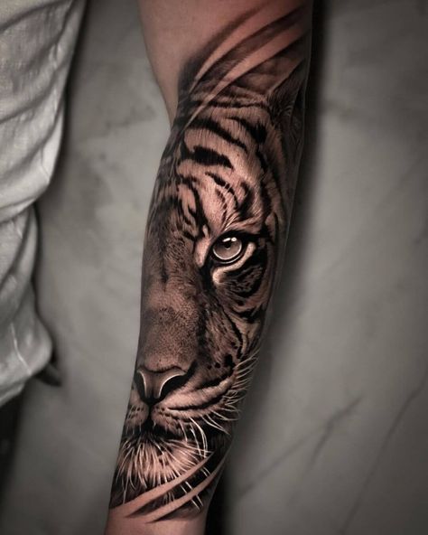 #Tattoos,Realistic Black and Grey Tiger Tattoos Realism Tattoo Ideas, Tiger Forearm Tattoo, Lion Shoulder Tattoo, Tiger Face Tattoo, Tiger Tattoo Sleeve, Hyper Realistic Tattoo, African Tattoo, Wolf Tattoo Sleeve, Famous Tattoos