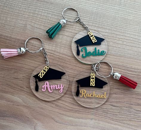 Personalised Graduation Keyring Gift, Personalised Graduation Keychain for graduate with 2023 year of graduation charm. You can choose your colour vinyl for the name. The graduation keyring is clear acrylic and 5cm diameter. Choose your tassel colour. Perfect personalised gift for a graduate. Thank you for your interest. Download Free keychain svg selection for high quality graphics! All of our free svg designs are compatible with both the Cricut and Silhouette machines. Graduation Acrylic Keychain Ideas, Vinyl Keyring Ideas, Graduation Keychain Diy, Personalised Graduation Gift, Graduation Suviners, Graduation Keychain Acrylic, Graduation Resin Ideas, Resin Graduation Gift, Clear Acrylic Keychain Ideas