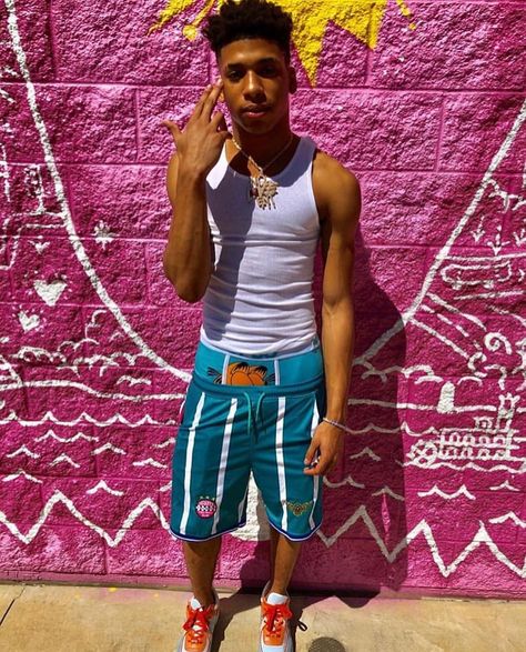 NLE Choppa wearing Hanes Tank Top, KidSuper Soccer Shorts, PSD Boxer Briefs, Chanel CC Logo Sneakers. Hanes Tank Top, Deven Hubbard, Saggin Pants, Lil Mosey, Mens Hairstyles Curly, Unique Outfit Ideas, Nle Choppa, Sagging Pants, Rapper Outfits