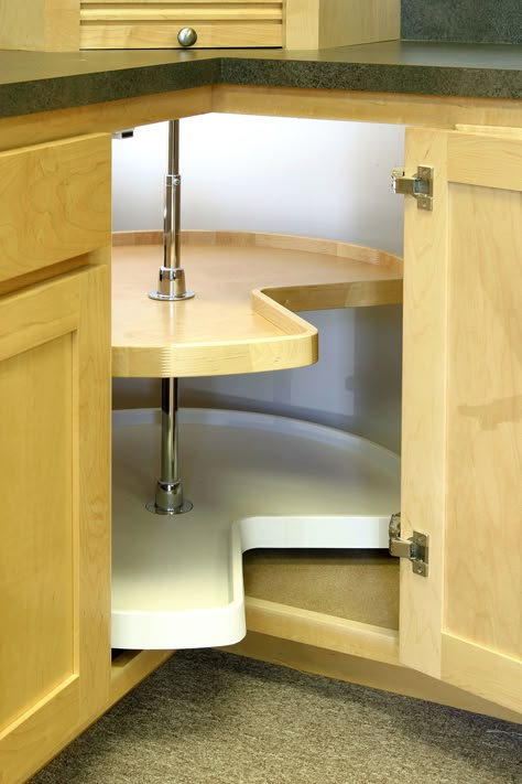 Steal back lost (and precious) storage in the far-away corners of cabinets by installing a lazy Susan. This turntable organizer also makes it easier to find containers that have been shoved to hard-to-reach corners. Corner Cabinet Solutions, Kitchen Cabinets Storage Organizers, Lazy Susan Cabinet, Kitchen Corner Storage, Corner Drawers, Diy Cabinet Doors, Kitchen Cabinets Doors, Corner Storage Cabinet, Cheap Kitchen Cabinets