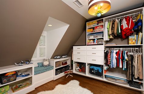 Making smart use of the available space in a room with sloped walls  I like the shelves and sitting area in front of the window. Rooms With Slanted Ceilings, Attic Bedroom Closets, Childrens Storage, Slanted Walls, Contemporary Closet, Attic Closet, Cool Kids Rooms, Attic Design, Wall Closet