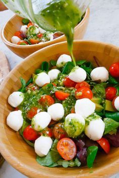 This is one of my favourite lunches. Fresh, satisfying, filling and unbelievably simple! The ingredients are very simple; 1 bag Mixed salad 2 handfuls Cherry tomatoes 2 handfuls Mozzarella 1 Avocado 2tbsp Pesto (ideally home made, but the fresh stuff from the fresh pasta aisle will do!) 4tsbp Olive oil Juice of 1 lemon... Read more Caprese Salad With Pesto, Salad With Pesto Dressing, Salad Caprese, Mixed Salad, Pesto Dressing, Healthy Comfort, Fresh Pasta, Wooden Bowl, Healthy Dishes