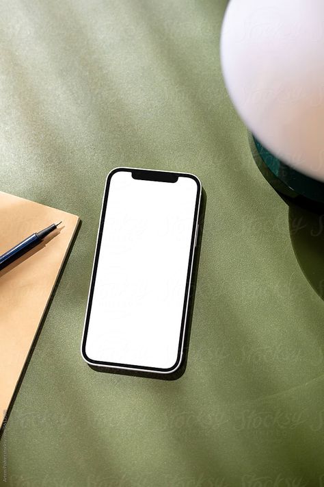 "A Mock-up Of A Mobile Phone With A White Screen On A Green Table" by Stocksy Contributor "Artem Podrez" - Stocksy Phone On Table, Clifford Chance, Vision Ideas, Hand Holding Phone, Minimalist Background, Phone Table, Mobile Mockup, Minimalist Phone, Website Mockup