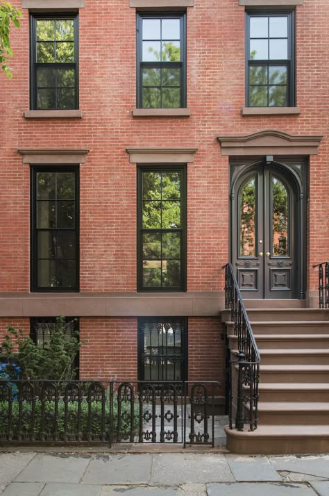 When a young family—a lawyer and dance professor and their two young sons—purchased a Brooklyn townhouse, the building had been subdivided into four apartm Black Windows Brick Exterior, Red Brick Townhouse, Black Windows Red Brick House, Brownstone Front Door, Black Windows Brick House, Brownstone Windows, Red Brick Black Windows, Brick House With Black Windows, Brownstone Remodel