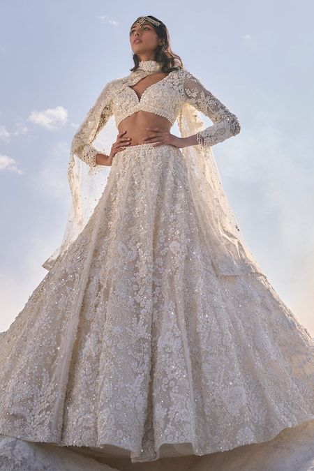 Buy Cream Net Embroidery Fabric Sweetheart 3d Floral Bridal Lehenga Set For Women by Seema Gujral Online at Aza Fashions. Lehenga White, Orang India, Pearl Tassels, Seema Gujral, Indian Wedding Gowns, White Indian Wedding, Indian Dresses Traditional, Embroidered Dupatta, Indian Bridal Outfits