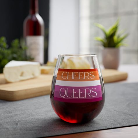 Raise a toast to love and equality with our Lesbian Bachelorette Party Wine Glass! This elegant glass features the phrase 'Cheers Queers,' making it perfect for bachelorette parties, weddings, and pride celebrations. Made from high-quality glass, it's durable. Add a touch of pride to your special day with this beautiful wine glass! #lesbian #gay #lgbtq #lesbianbachelorette #bachelorette Lesbian Bachelorette Party Ideas, Lesbian Bachelorette Party, Lesbian Bachelorette, Wine Bachelorette Party, Bachelorette Party Themes, Bach Party, Wine Parties, Bachelorette Parties, Wine Glasses