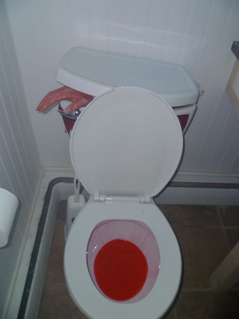 Halloween Bathroom Idea!  Wick a bottle of red pool dye, tip to the side...blood red flush everytime!  Put a red glow stick inside toilet tank, severed hand in tank sticking out!  Awesome! Halloween Bathroom Decorations, Halloween Bathroom Decor, Halloween Decorating Ideas, Cheap Diy Halloween Decorations, Halloween Bathroom, Casa Halloween, Halloween Fest, Halloween House Party, Modern Halloween