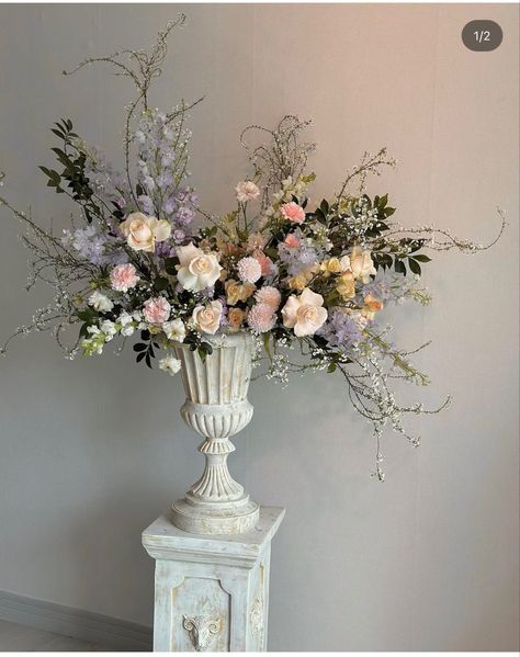 Baroque Flower Arrangements, Flower Arrangement Cake, Wedding Flower Columns, Ceremony Urns Wedding, Rococo Flower Arrangement, Victorian Floral Arrangements, Wedding Flower Urns, Stone Vase Centerpiece, Bridgerton Flower Arrangements