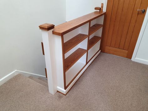 Banister bookcase constructed from plywood and framed and shelved with stained oak. Banister With Storage, Landing Banister Ideas Upstairs, Bookcase Next To Stairs, Banister Bookcase, Bookshelf Banister, Bookcase Banister, Stairway Bookcase, Stair Bookcase, Staircase Banister Ideas