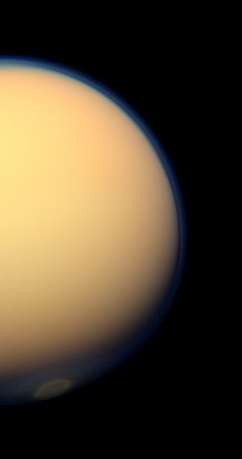 The recently formed south polar vortex stands out in the color-swaddled atmosphere of Saturn's largest moon, Titan, in this natural color view from NASA's Cassini spacecraft. Cassini Spacecraft, You Are My Moon, Polar Vortex, Planets And Moons, Nasa Jpl, Our Solar System, Space Science, Space And Astronomy, Colour Photograph