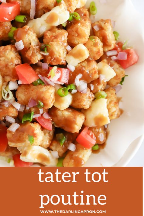 Tater tot poutine on a parchment lined white platter. Overhead shot Tater Tot Bar, Tater Tot Poutine, Crispy Baked Ravioli, French Fry Recipe Baked, French Fry Recipes, Loaded Tater Tot, Chicken Gumbo Soup, Poutine Fries, Cheesy Tater Tots