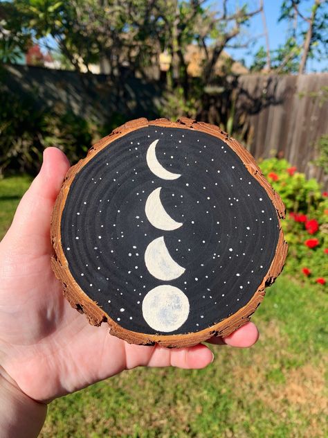 "Moon Phase Wood Slice Painting!  This is an acrylic painting of the phases of the moon created on a wood slice. The wood slices can vary in sizes between 4.5\"-5.5\" which makes each piece unique! **IMPORTANT** These are made to order and will take 2-5 days to be finished and shipped out! I strive to get all orders out as quickly as possible, but due to extreme delays within shipping carriers because of the holiday season, orders have a chance of being delayed. Thank you for understanding!" Moon Phase Painting, Wood Slice Painting, Painting Moon, Witch Painting, Bohemian Crafts, Art Witch, Circle Painting, Wood Slice Art, Wood Slice Crafts