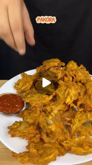 ABD on Instagram: "Aloo pyaz Pakoda 
Ingredients:
- 2 large potatoes, peeled and sliced
- 1 large onion, sliced
- 1 cup chickpea flour (besan)
- 1/2 cup all-purpose flour
- 1/2 teaspoon baking soda
- 1/2 teaspoon salt
- 1/4 teaspoon black pepper
- 1/4 teaspoon cumin seeds
- 1/4 teaspoon coriander seeds
- 1/4 teaspoon turmeric powder
- 1/4 teaspoon red chili powder
- 1/2 cup water
- Oil, for frying

Instructions:
1️⃣ Mix flours, baking soda, salt, and spices.
2️⃣ Add water and mix well.
3️⃣ Add potato and onion slices and mix.
4️⃣ Fry until crispy and golden brown!
5️⃣ Serve hot with chutney or raita!

#AlooPyazPakoraLove #AlooPyazPakoraRecipe #PakoraParty #FoodieFun #RecipeReel #FoodLover #SnackTime #Yum #Tasty #Delicious #IndianFood #Foodstagram #InstaFood #ReelFood #foodstagram#asmr  #Fo Onion Pakoda, Pakoda Recipe, Carom Seeds, Ginger Garlic Paste, Red Chilli Powder, Food Asmr, Potato Onion, Vegetarian Snacks Recipes, Gram Flour