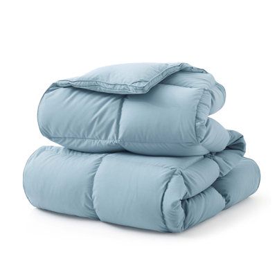 Cloud-like comfort. Lounge, relax, or nap on this all-season comforter. Made with a polyester microfiber cover, this comforter is stuffed with 600 cubic inches of down-filling made from goose feathers and fibers. It features a baffle box stitch that evenly distributes the down across the comforter, ensuring even warmth and padding across your bed. We love that it comes with duvet ties at the corners, making it easy to slip into a cover of your choice (sold separately). To care for it, just machi Duvet Ties, Grey Comforter, Box Stitch, Down Comforters, Goose Feather, White Goose, Twin Comforter, Bedding Essentials, Goose Feathers