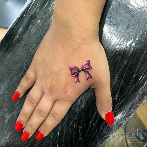 Colored bow tattoo Bow Finger Tattoos For Women, Bow Hand Tattoo, Bow Tattoos For Women, Bow Tattoo Ideas, Bow Finger Tattoos, Small Bow Tattoo, Bow Tattoos, Finger Tattoo For Women, Bow Tattoo