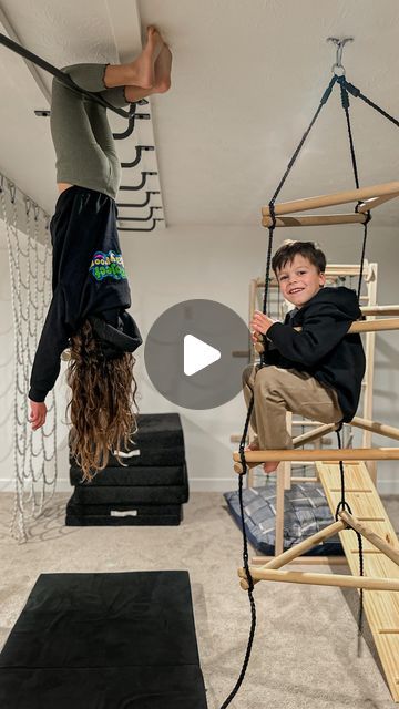 Emily Russo | Content creator on Instagram: "The monkey bar phase of our playroom is finally finished! 👏🏻 I cannot tell you how big of a hit these have been, we have had over a dozen kids over in the last few weeks and we could hardly pry them out of the basement. 😂  One of the best things about the addition of monkey bars is that you can scale up your playroom without losing any floor space! Whether you have a large playroom or smaller adding monkey bars creates a lot of opportunities for creative play! The @projectplayrooms bars are incredible quality and their customer service is top notch. If you’re looking to expand your kiddos play area they have a ton of fun products!   #projectplayroom #playroominspiration #grossmotorskills #grossmotorplay #creativeplay #monkeybars #playroominte Jungle Gym Basement, Ceiling Monkey Bars, Diy Active Playroom, Playroom Monkey Bars, Active Playroom, Large Playroom, Indoor Monkey Bars, Bar In Living Room, Indoor Playroom